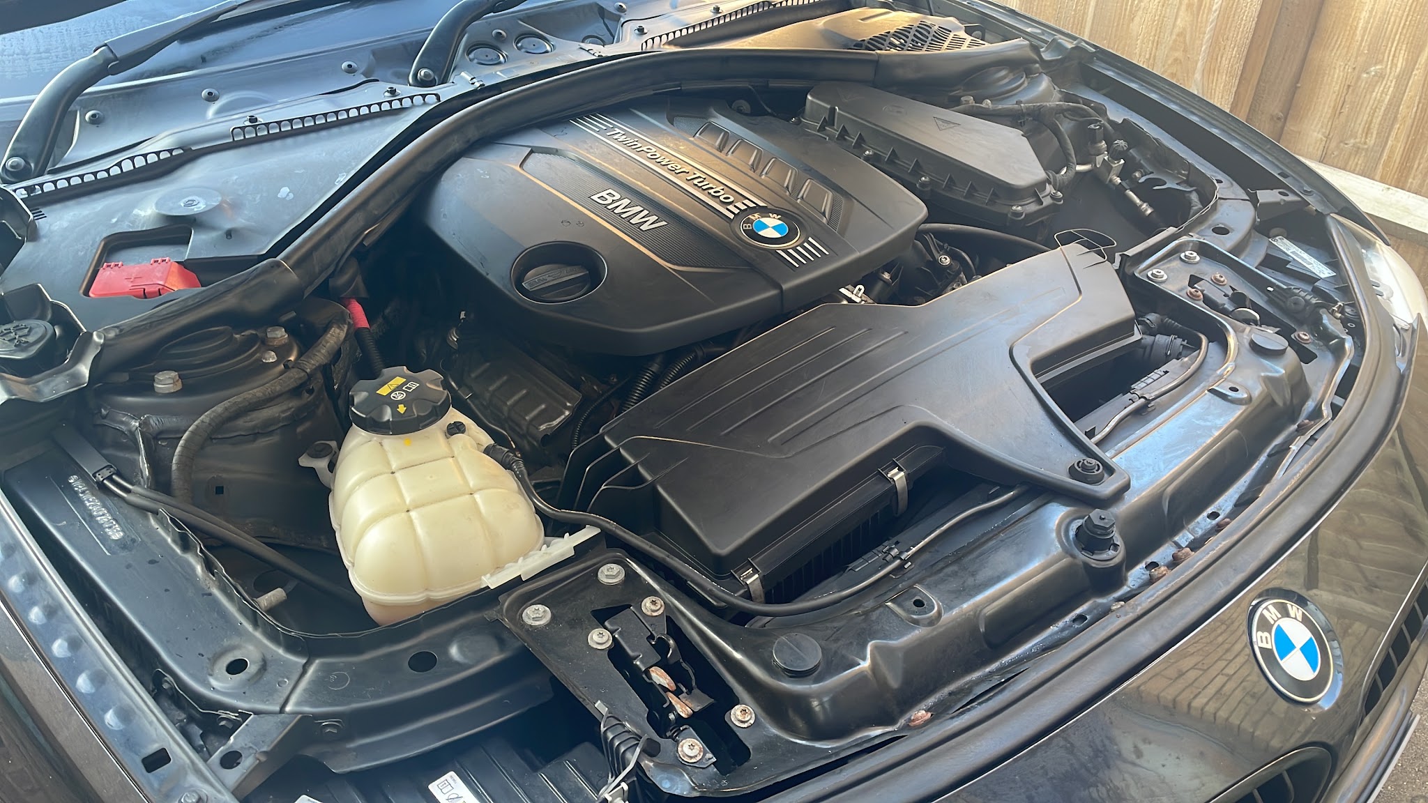 Under the bonnet of a BMW in the workshop